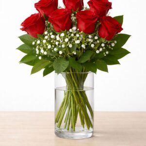 Seven red roses with white baby's breath and greenery in a glass vase – Red Romance by Raindrops Flower