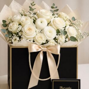 Elegant white rose arrangement in luxury black and gold gift box by Raindrops Flower Vancouver