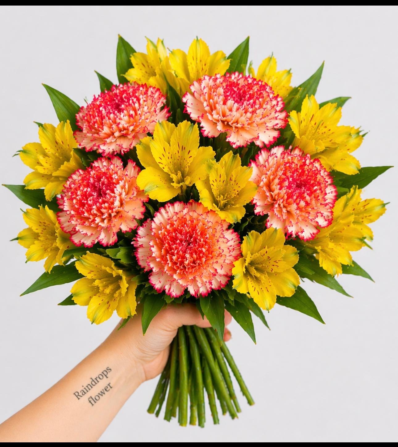 Sunny carnation and yellow alstroemeria bouquet held in hand, bright and cheerful Mother’s Day flowers